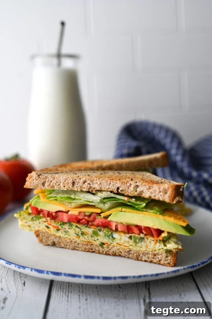 A wonderful make ahead breakfast of easy sheet pan eggs full of vegetables for the most delicious and convenient breakfast sandwich.