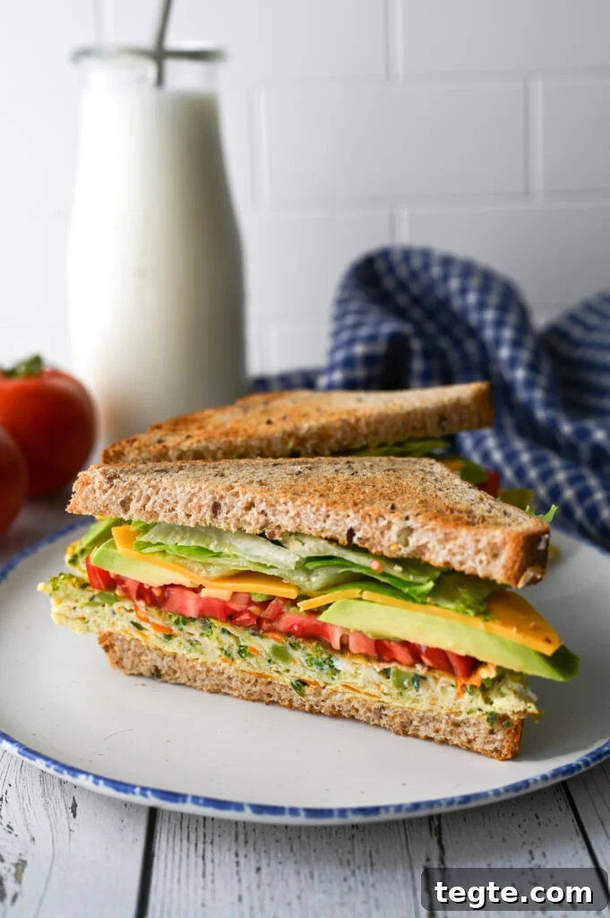A wonderful make ahead breakfast of easy sheet pan eggs full of vegetables for the most delicious and convenient breakfast sandwich.