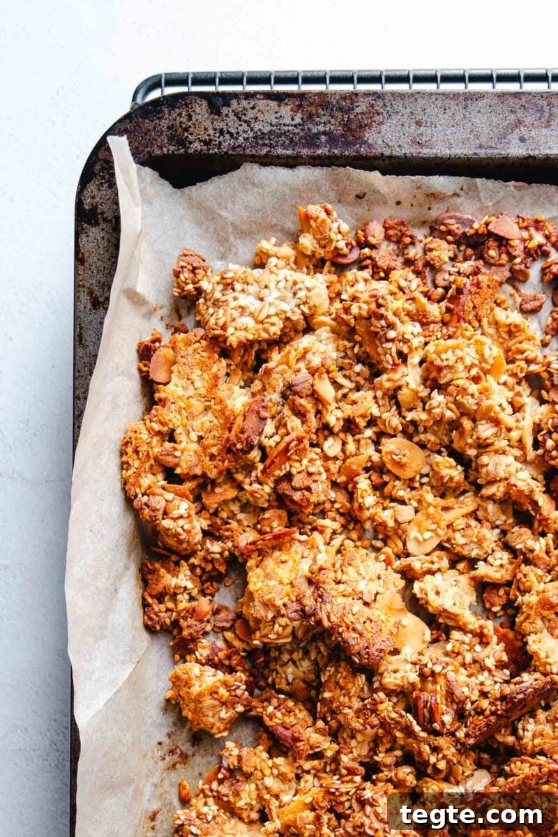 Wholesome granola baked on parchment paper.