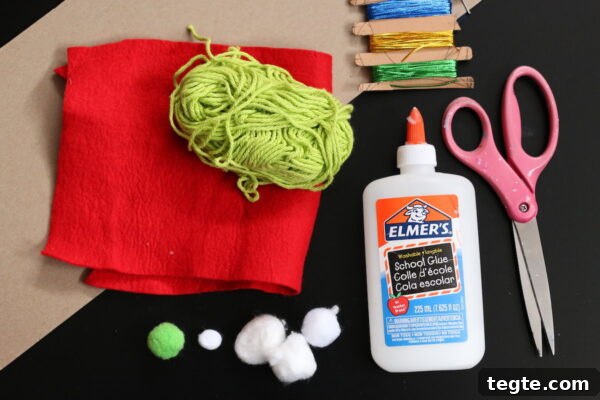 Grinch Gnome Ornament Made with Yarn and Cardboard 3 cardboard, red felt, green yarn, pom poms, glue and scissors
