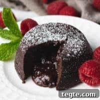 Molten lava cake with raspberries and mint.