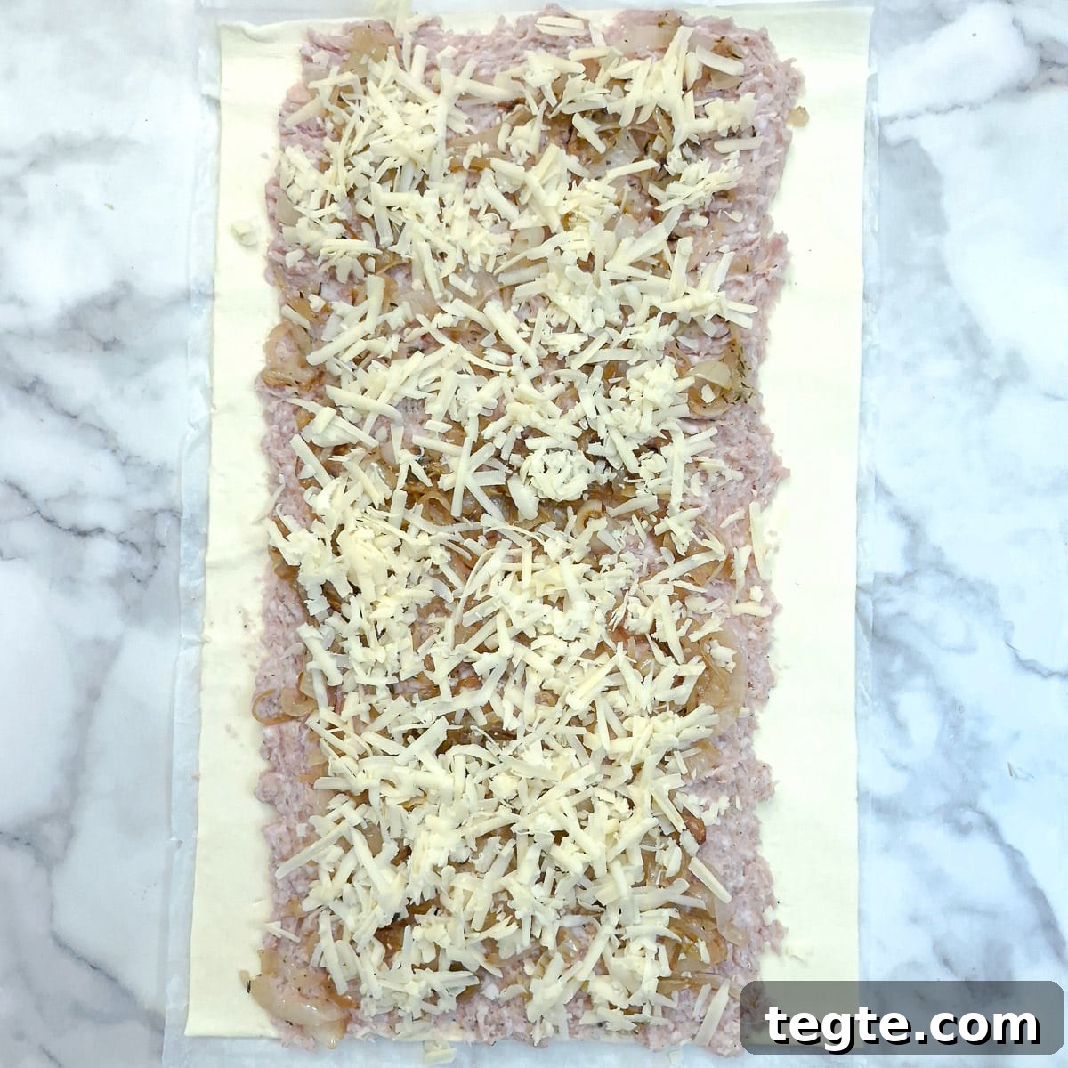 Savory Sausage and Caramelized Onion Pinwheel Appetizers 9 Grated cheese added to the sausage filling.