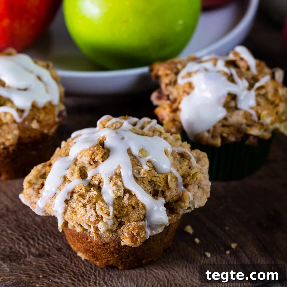 Apple Spice Muffins drizzled with glaze.