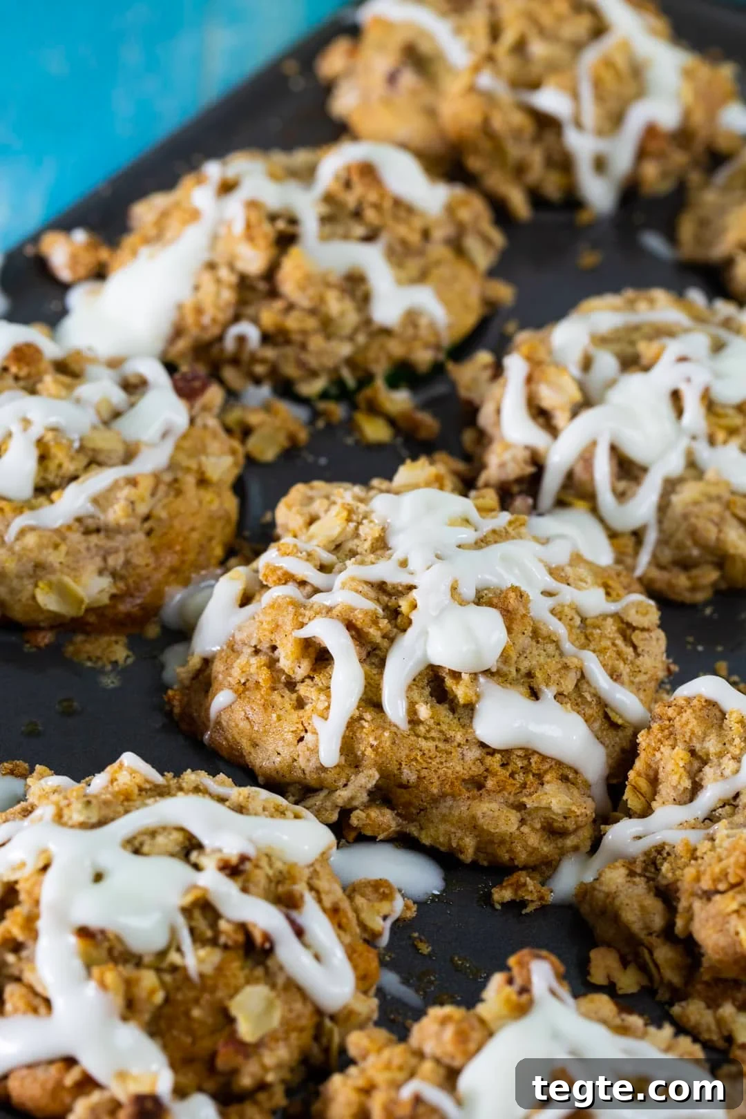 Muffins in muffin tin with glaze on them.
