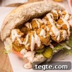 Crispy Oyster Po'Boy Sandwich Recipe for Classic New Orleans Flavor 10 Po Boy bread filled with crispy fried oysters and remoulade sauce drizzled over the top