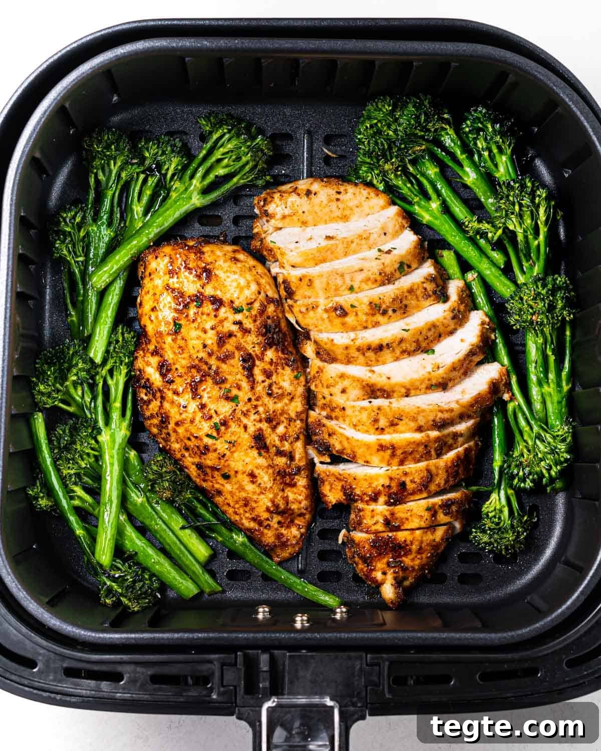 Crispy Juicy Air Fryer Chicken Breast Recipe in 20 Minutes 6 air fried chicken breasts in air fryer basket.