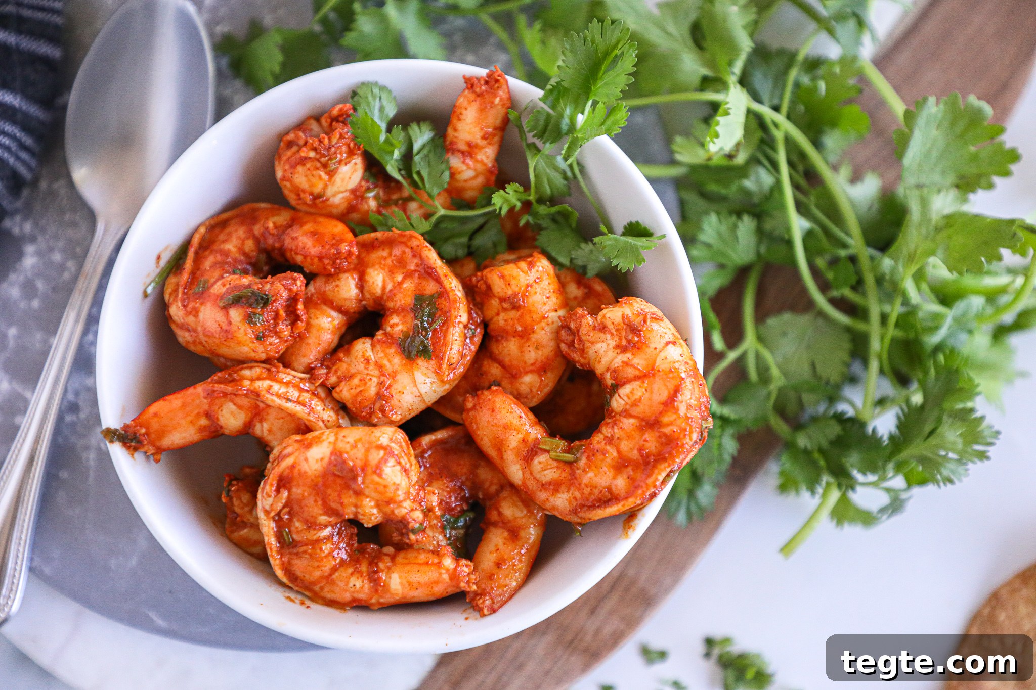 Spicy Shrimp Tostadas with Creamy Guacamole 3 This chili lime shrimp is made with just a handful of ingredients and takes minutes to saute on the stove!You can put them on your tacos, salads, nachos or even eat them as is!