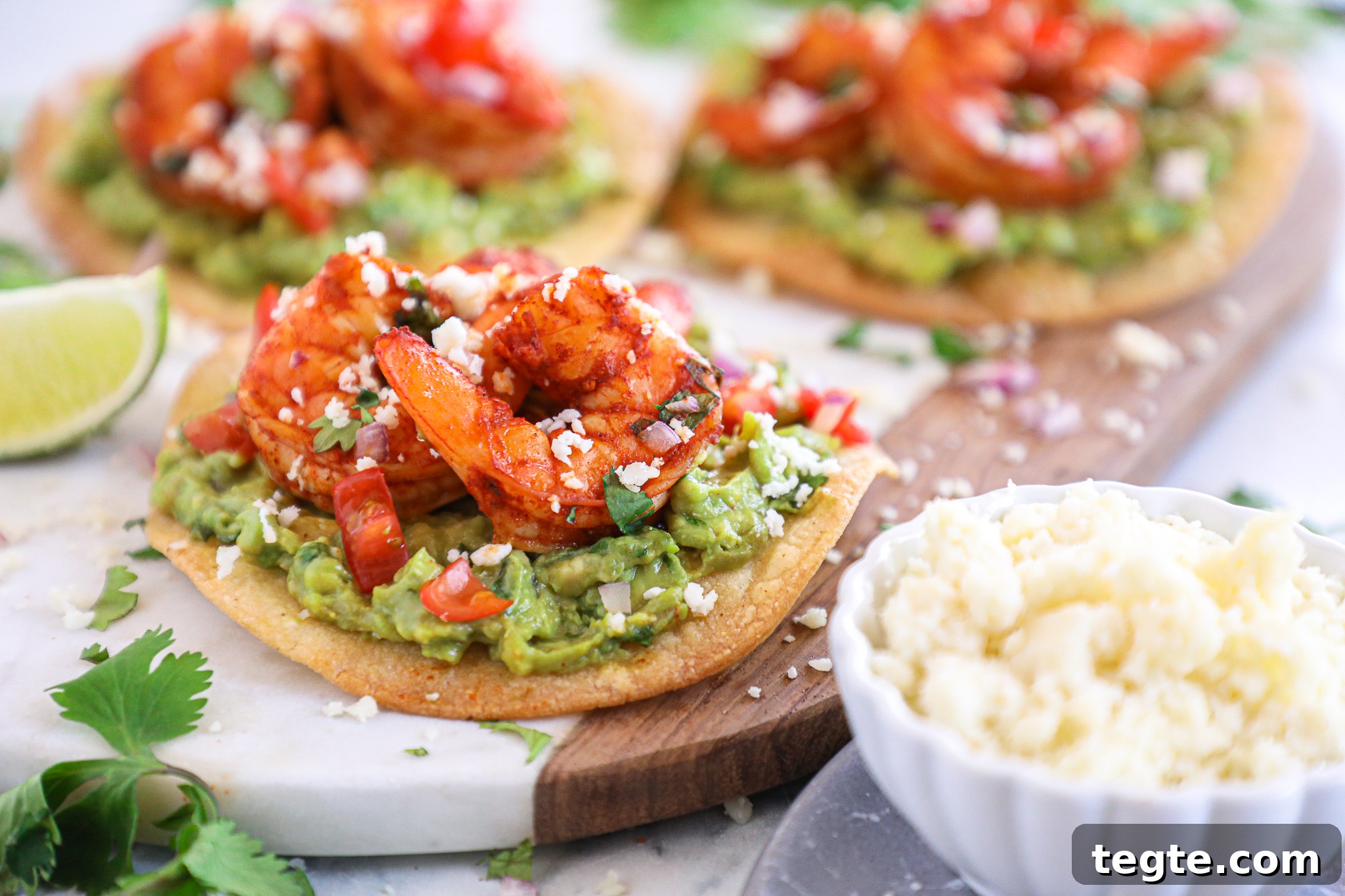 Spicy Shrimp Tostadas with Creamy Guacamole 4 Spicy shrimp tostadas are such an easy meal for during the week! They take no time at all to make and are packed full with flavor!