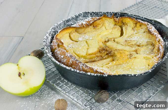 Caramel Apple Dutch Baby in a cast iron skillet