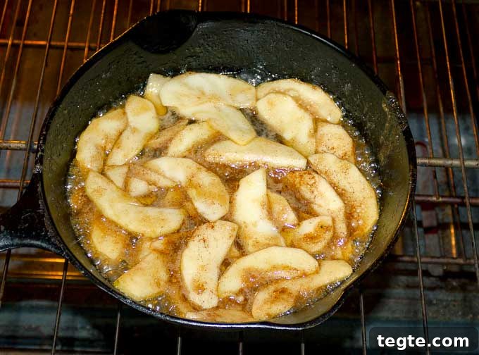 apples and caramel in a cast iron skillet