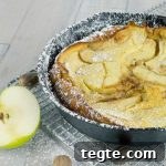 Caramel Apple Dutch Baby in a cast iron skillet