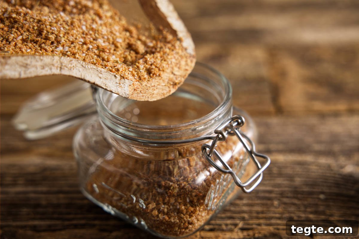 Dumping the pork dry rub into a airtight container.