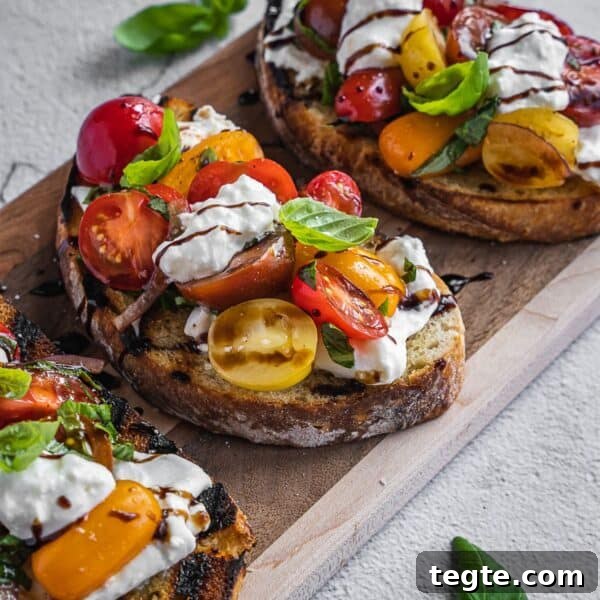 Creamy Burrata Bruschetta with Heirloom Tomatoes and Basil 14 Burrata bruschetta toasts with cherry tomatoes and cheese.