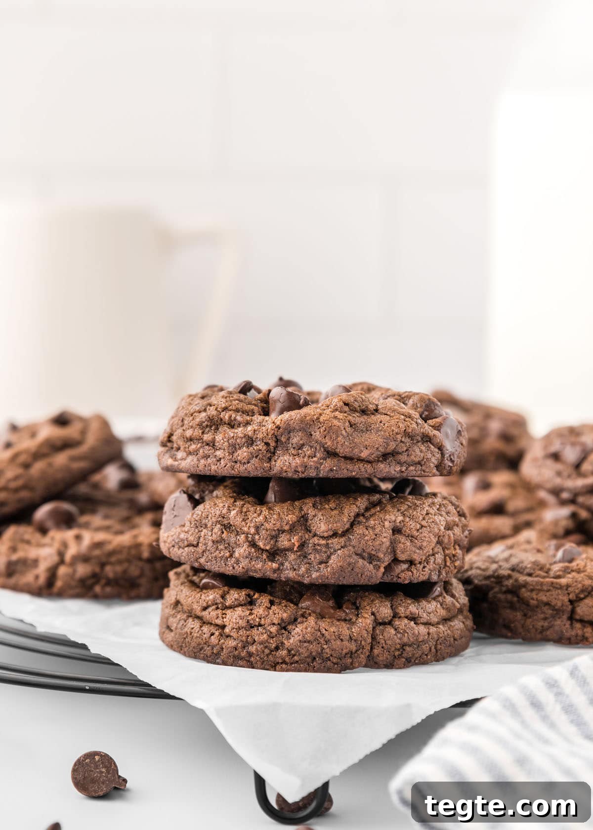 Ultimate Double Chocolate Cookies Recipe: Moist, Fudgy Bites 3 A stack of double chocolate chip cookies on a wire rack.