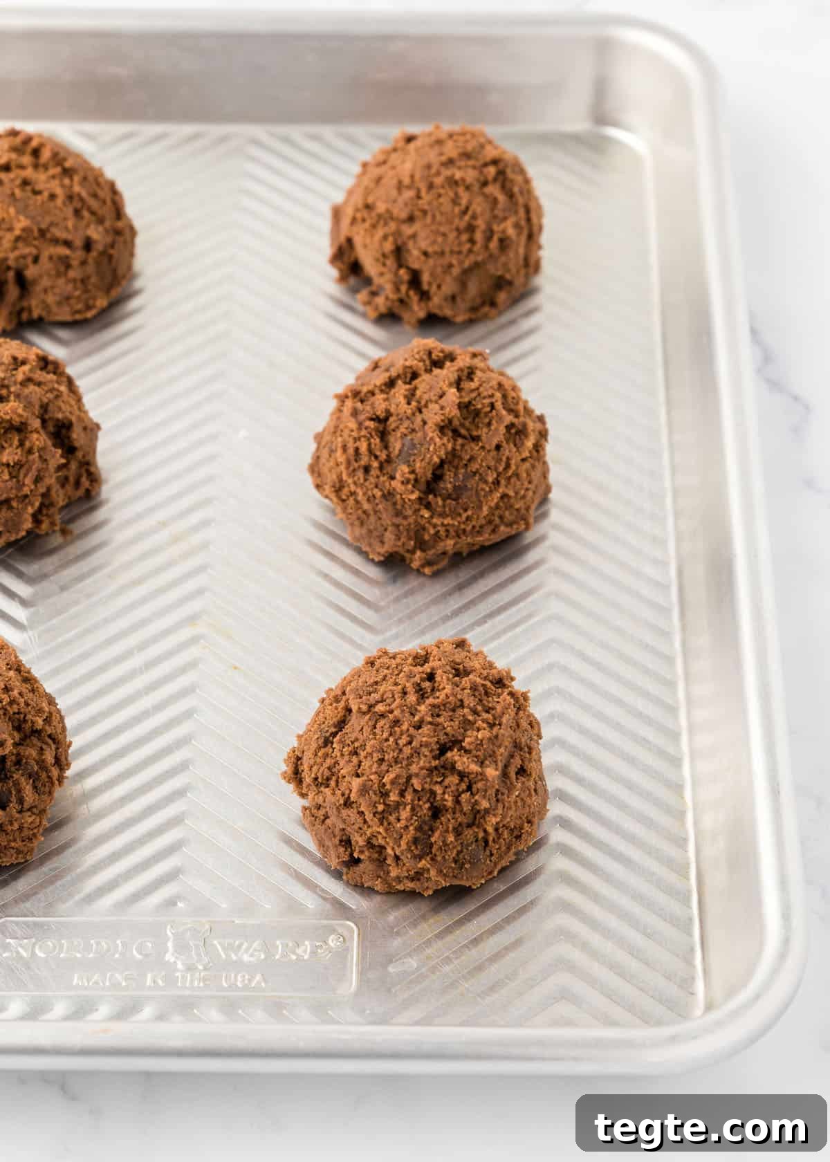 Ultimate Double Chocolate Cookies Recipe: Moist, Fudgy Bites 6 Double chocolate chip dough balls on a baking sheet.