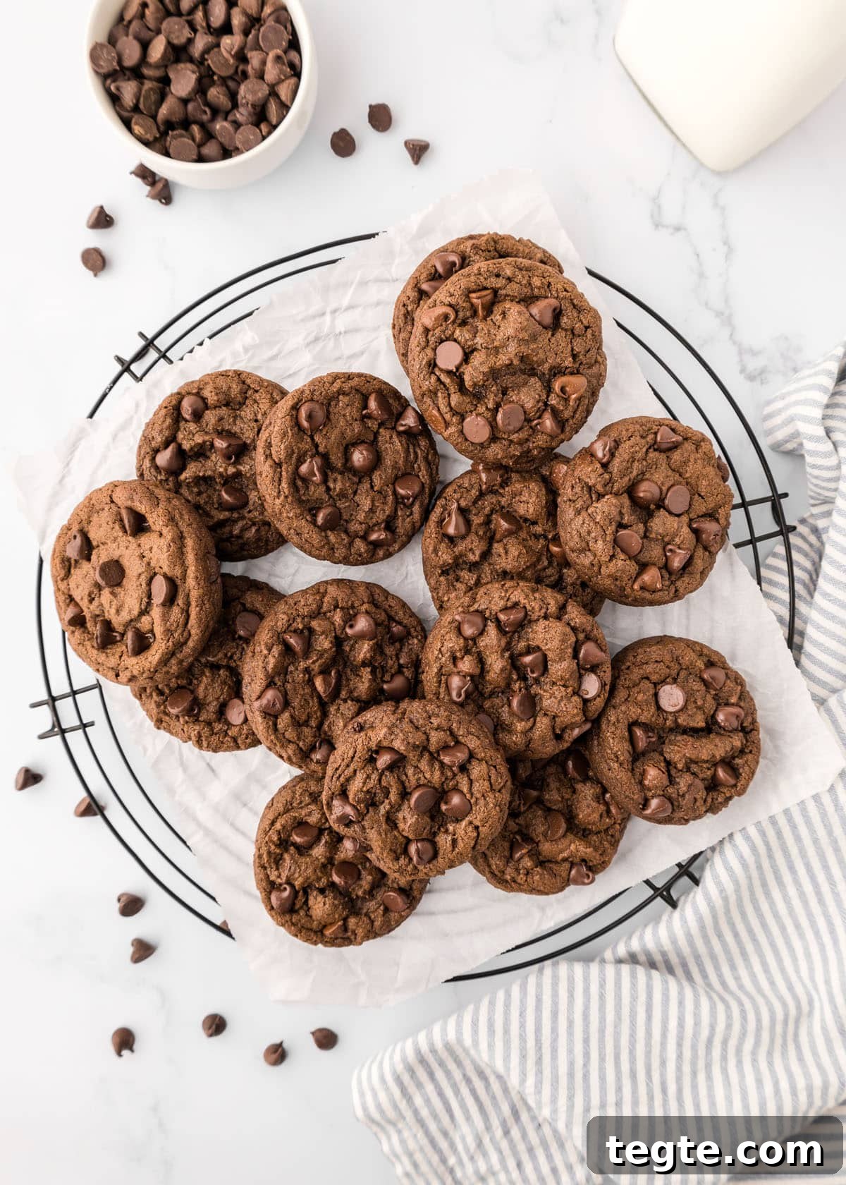 Ultimate Double Chocolate Cookies Recipe: Moist, Fudgy Bites 7 Double chocolate chip cookies on a wire rack.