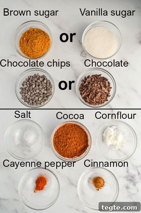 How to Make Spiced Hot Chocolate Mix for Cozy Winter Drinks 4 tagged list of ingredients for spiced hot chocolate mix including brown sugar or white sugar, chocolate chips or chocolate, salt, cocoa, cornflour, cayenne pepper and cinnamon
