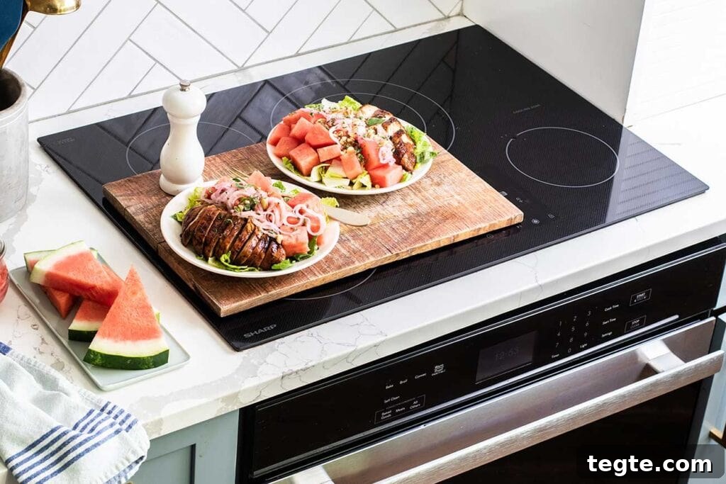 Balsamic Chicken with Watermelon Salad Recipe for Summer 3 Two watermelon balsamic chicken salads sitting on top of the Sharp Induction Cooktop.