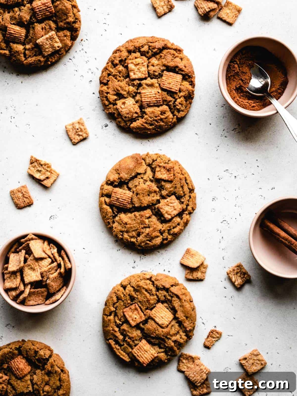 Three cereal cookies on a white background.