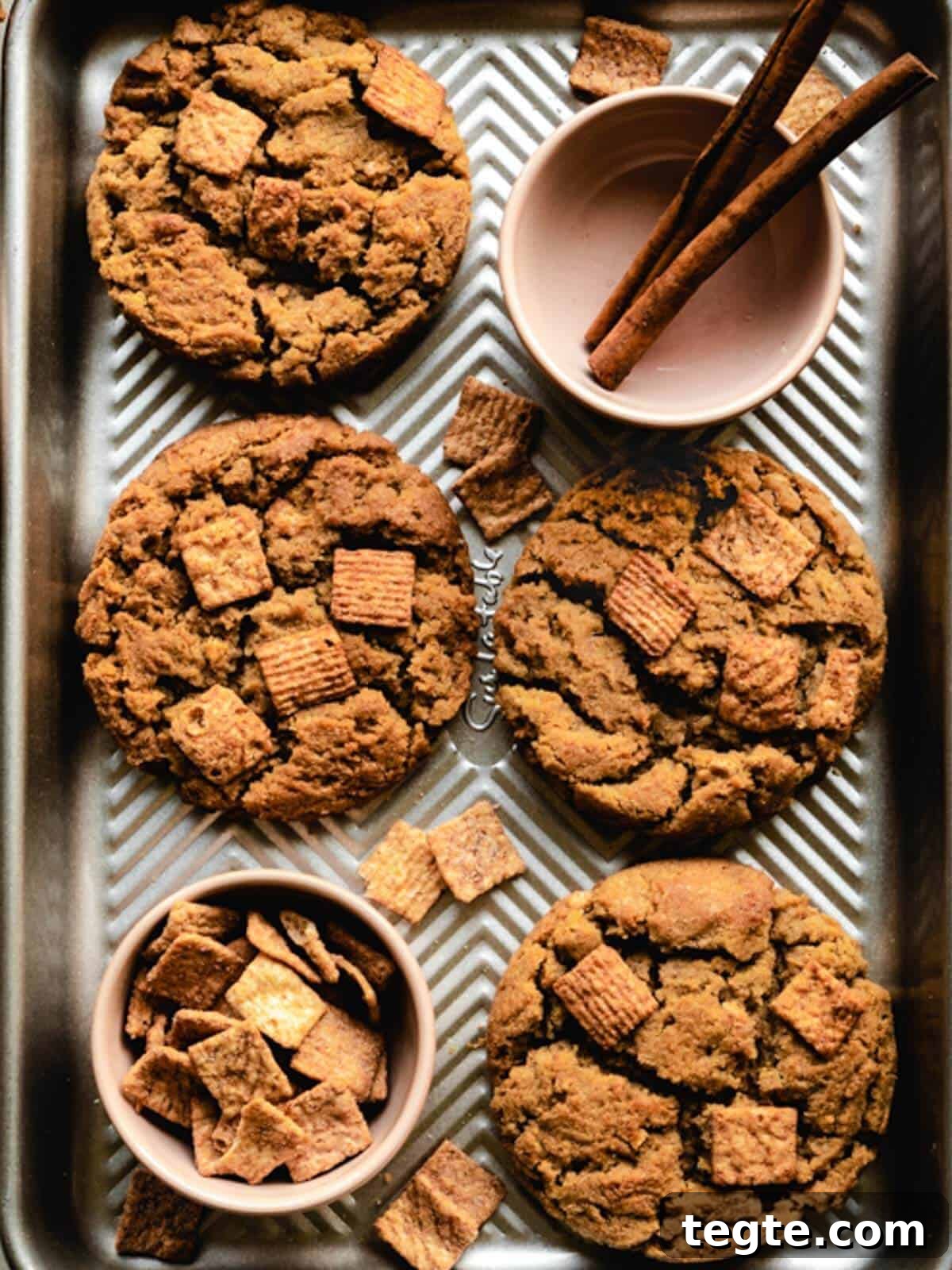 Cinnamon Toast Crunch Cookies fresh out of the oven on a baking tray.