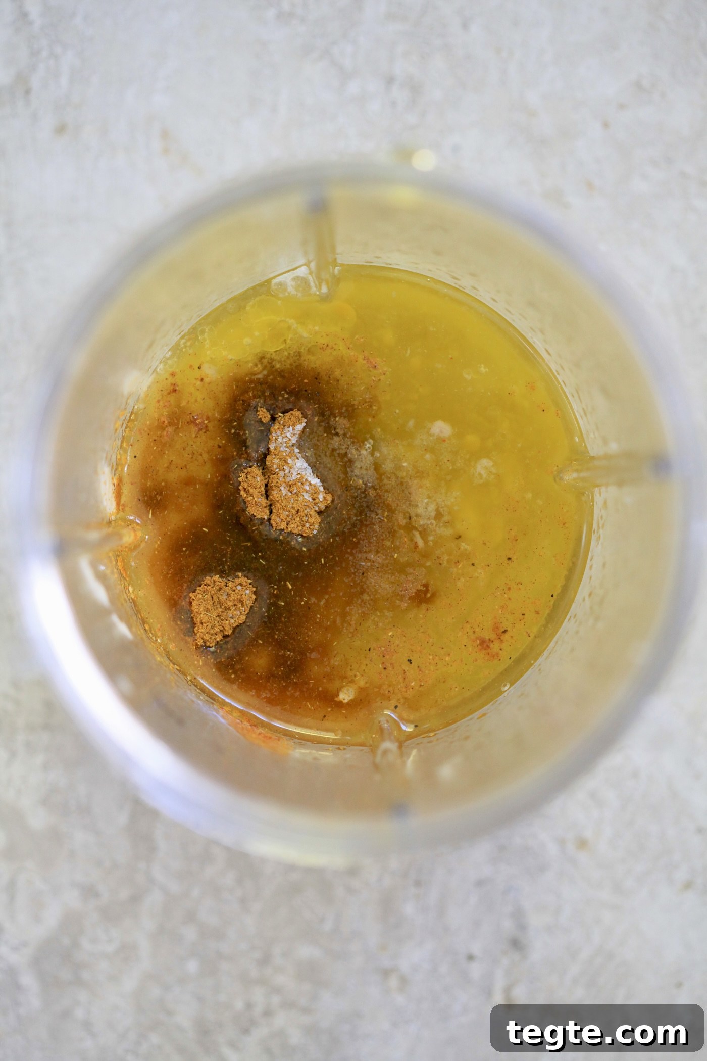 Lightened Curry Chicken Salad Without Mayo — Creamy & Flavorful 3 olive oil and curry powder in plastic jar