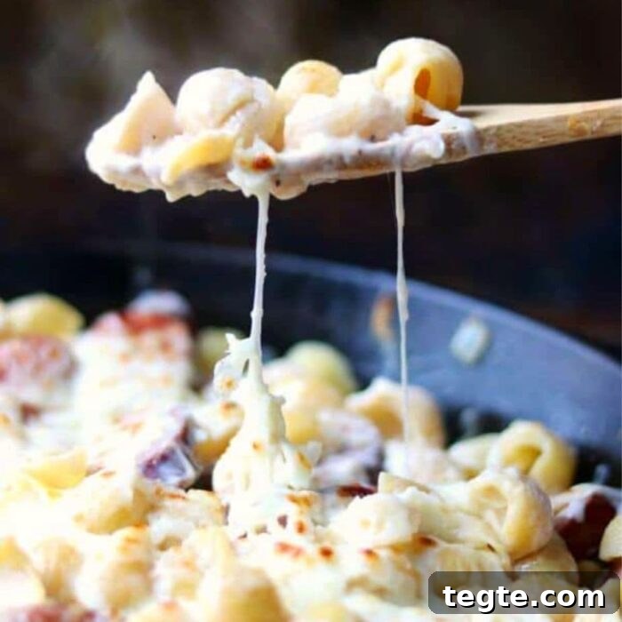 7-Day January Meal Plan: Simple Recipes for the New Year 22 a serving of sausage alfredo bing removed from a skillet