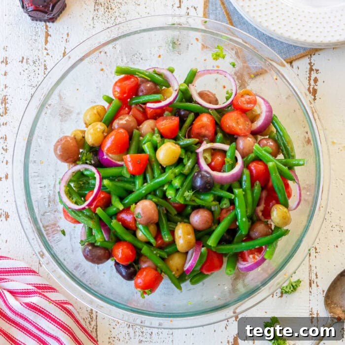 7-Day January Meal Plan: Simple Recipes for the New Year 23 Overhead view of a bowl of green beans, tomatoes, potatoes, and red onions created for the feature image of this post.