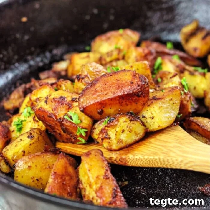 7-Day January Meal Plan: Simple Recipes for the New Year 7 Wooden spatula removing fried potatoes out of iron skillet.