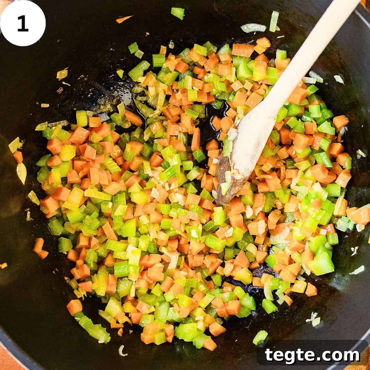 Hearty Homemade Chicken and Vegetable Soup Recipe 4 Frying chopped vegetables in a saucepan.