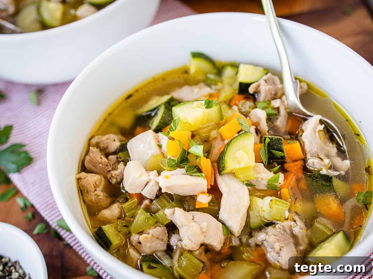 Hearty Homemade Chicken and Vegetable Soup Recipe 9 Close up of a bowl of soup of chicken and vegetables.
