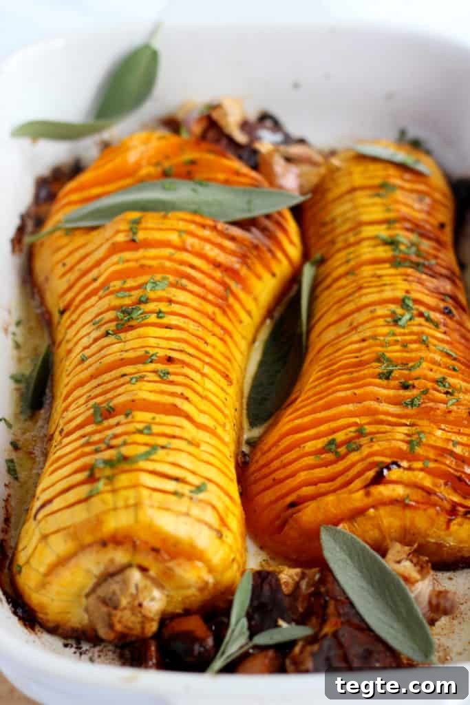 Crispy Roasted Hasselback Butternut Squash Recipe 5 baked hasselback butternut squash with sarfan leaves and galic bulbes