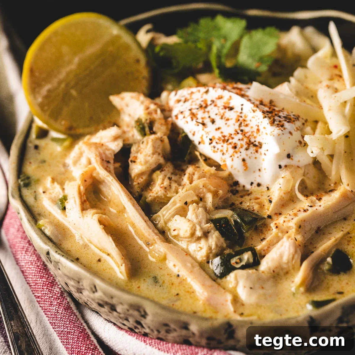 14 Pepper Recipes to Turn Up Flavor on Your Grill 5 White chicken chili in white bowl with lime wedge.