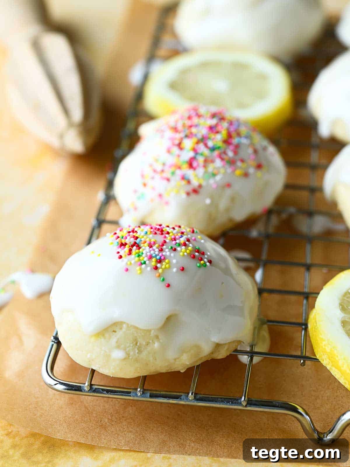 Italian Lemon Drop Cookies Recipe — Zesty Citrus Shortbread Tips 2 Close-up of Italian lemon drop cookies on a wire rack with multi-colored sprinkles on top.