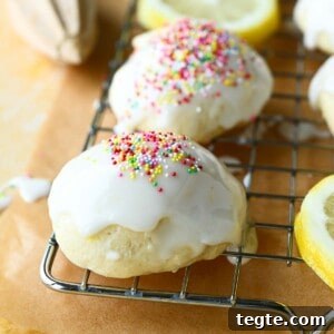 Italian Lemon Drop Cookies Recipe — Zesty Citrus Shortbread Tips 16 Close-up of Italian lemon drop cookies on a wire rack with multicolored sprinkles on top.