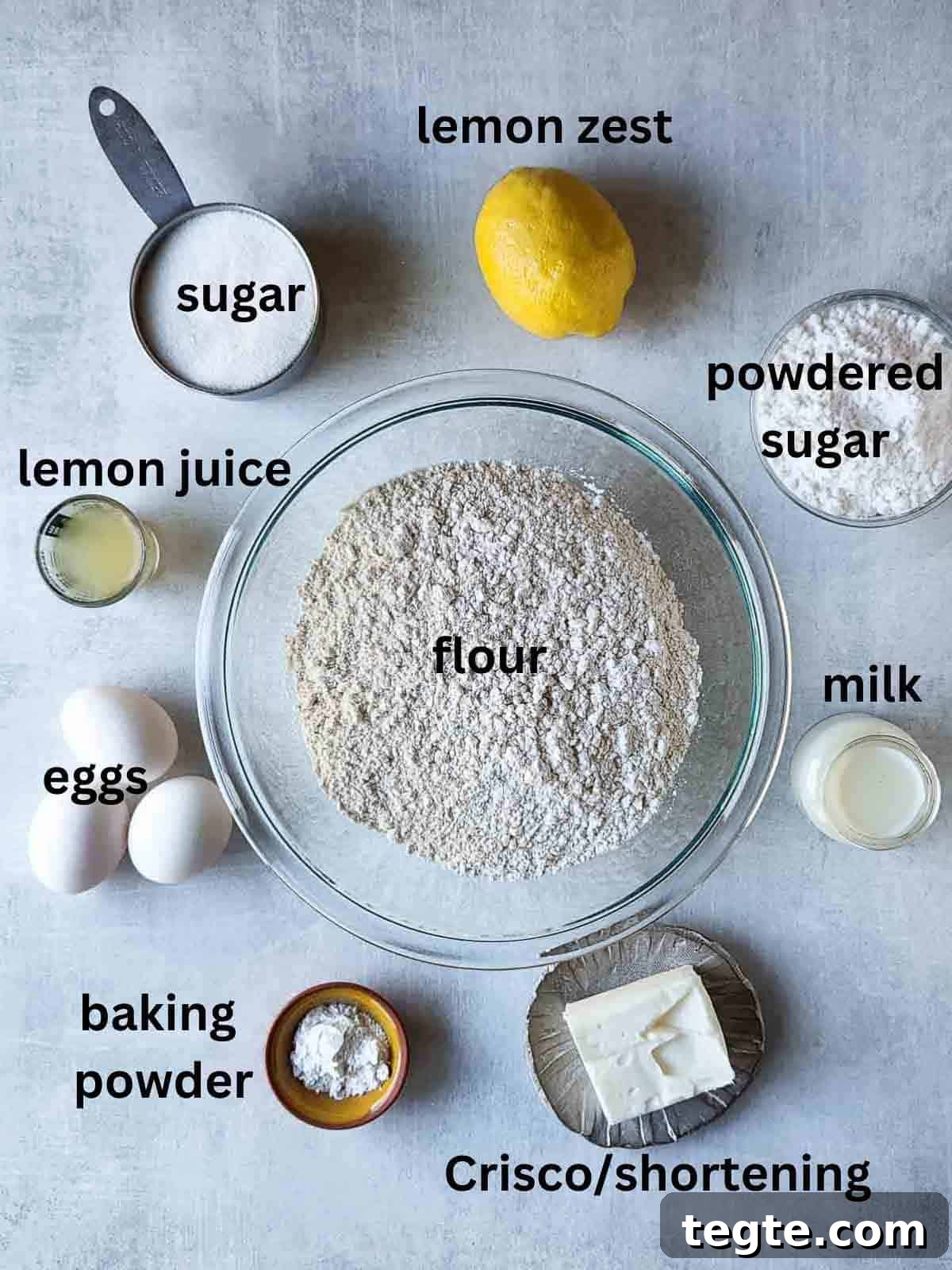 Italian Lemon Drop Cookies Recipe — Zesty Citrus Shortbread Tips 3 Ingredients for Italian lemon drop cookies on a grey surface.