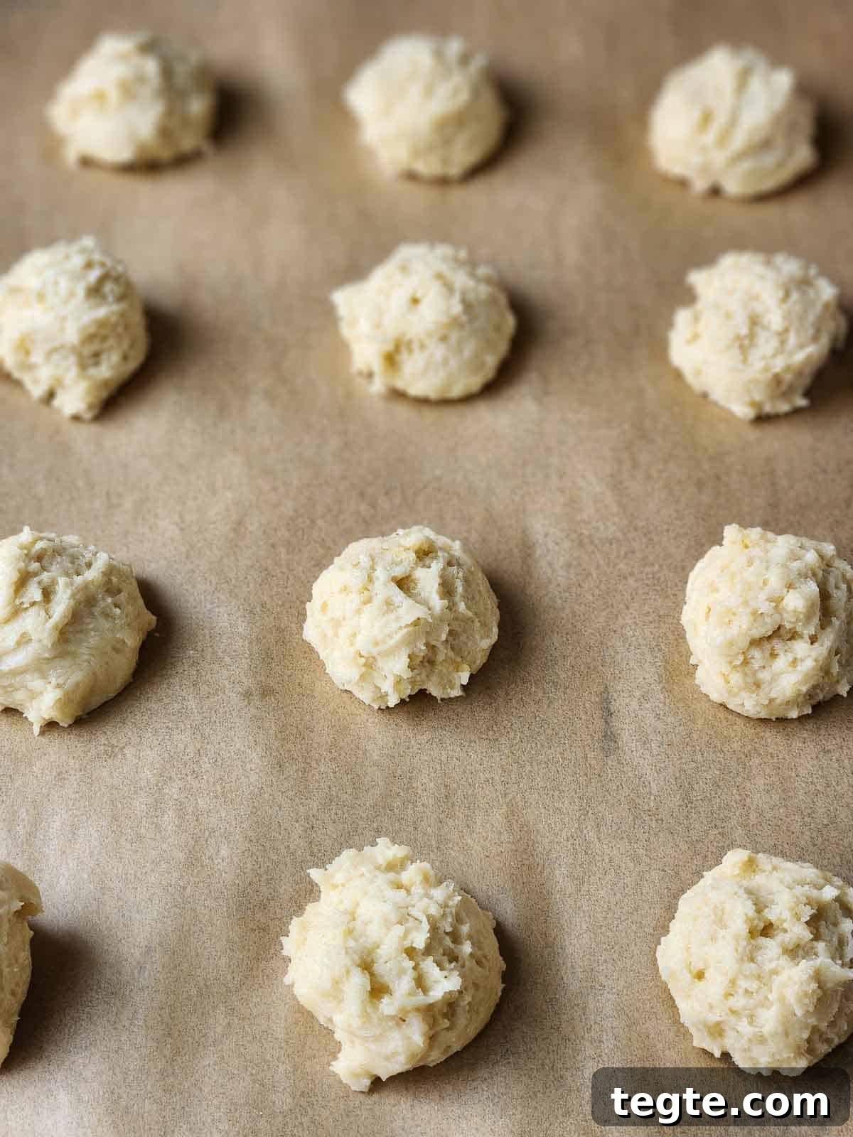 Italian Lemon Drop Cookies Recipe — Zesty Citrus Shortbread Tips 7 Mounds of cookie batter on parchment paper.