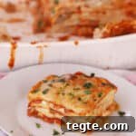 homemade lasagna on a white plate