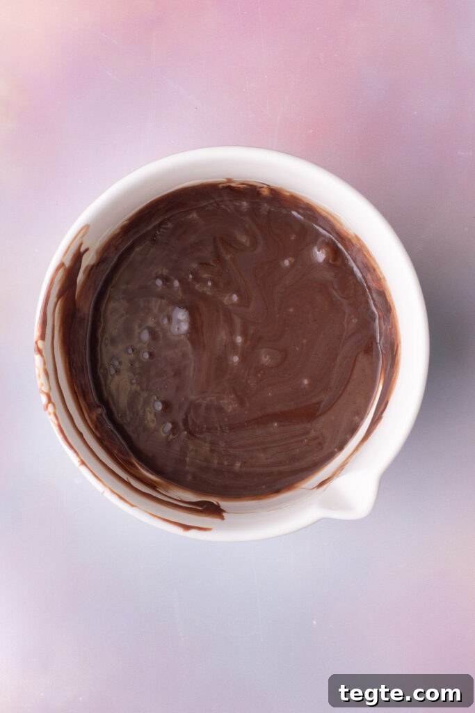 Chocolate chips melted into condensed milk and whisked until smooth.
