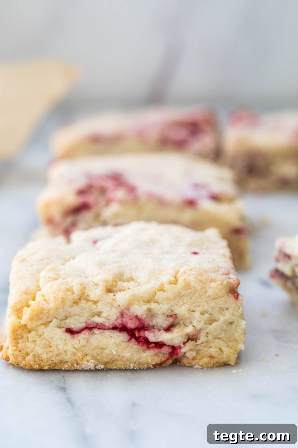 One scone closeup and three others in the background