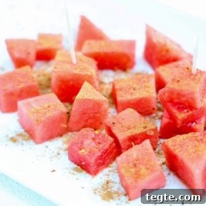 Chunks of fresh watermelon topped with Tajin and cinnamon.