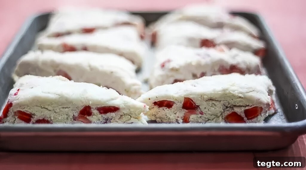 Strawberry Lemon Scones Recipe — Light, Flaky & Zesty 3 step 4: a batch of strawberry lemon scones on a sheet pan, ready for the oven