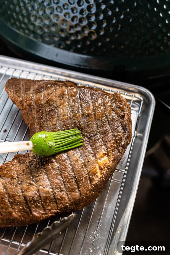 Smoked Tri-Tip Roast: Flavorful Low-and-Slow BBQ Recipe 4 brushing oil on smoked tri tip