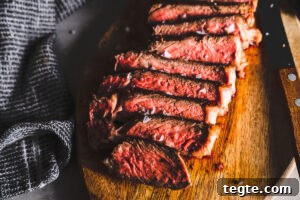 Smoked Tri-Tip Roast: Flavorful Low-and-Slow BBQ Recipe 10 new york strip steak sliced on cutting board featured horizontal