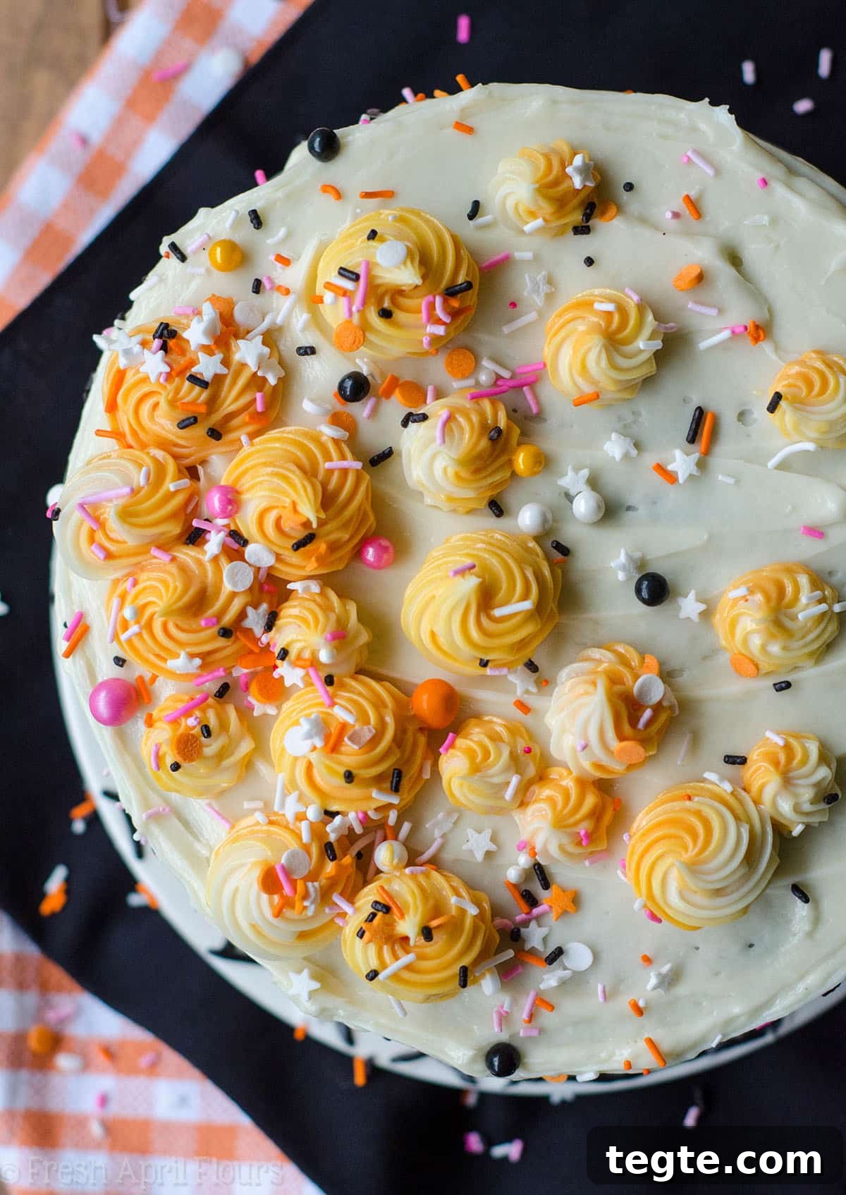 Ultimate Black Velvet Cake Recipe: Moist, Decadent Chocolate Layer Cake 3 aerial photo of black layer cake with orange and pink sprinkles
