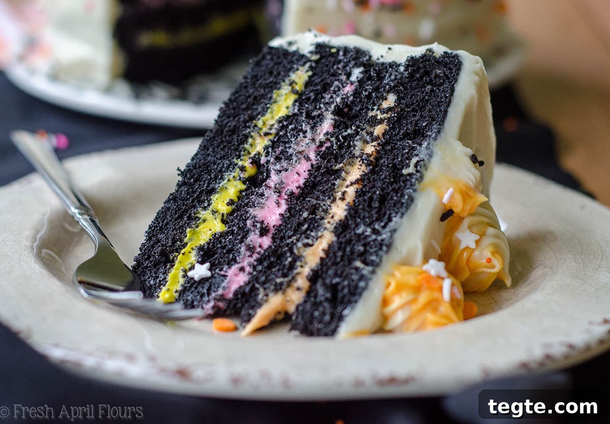 Ultimate Black Velvet Cake Recipe: Moist, Decadent Chocolate Layer Cake 7 slice of black velvet layer cake on a plate