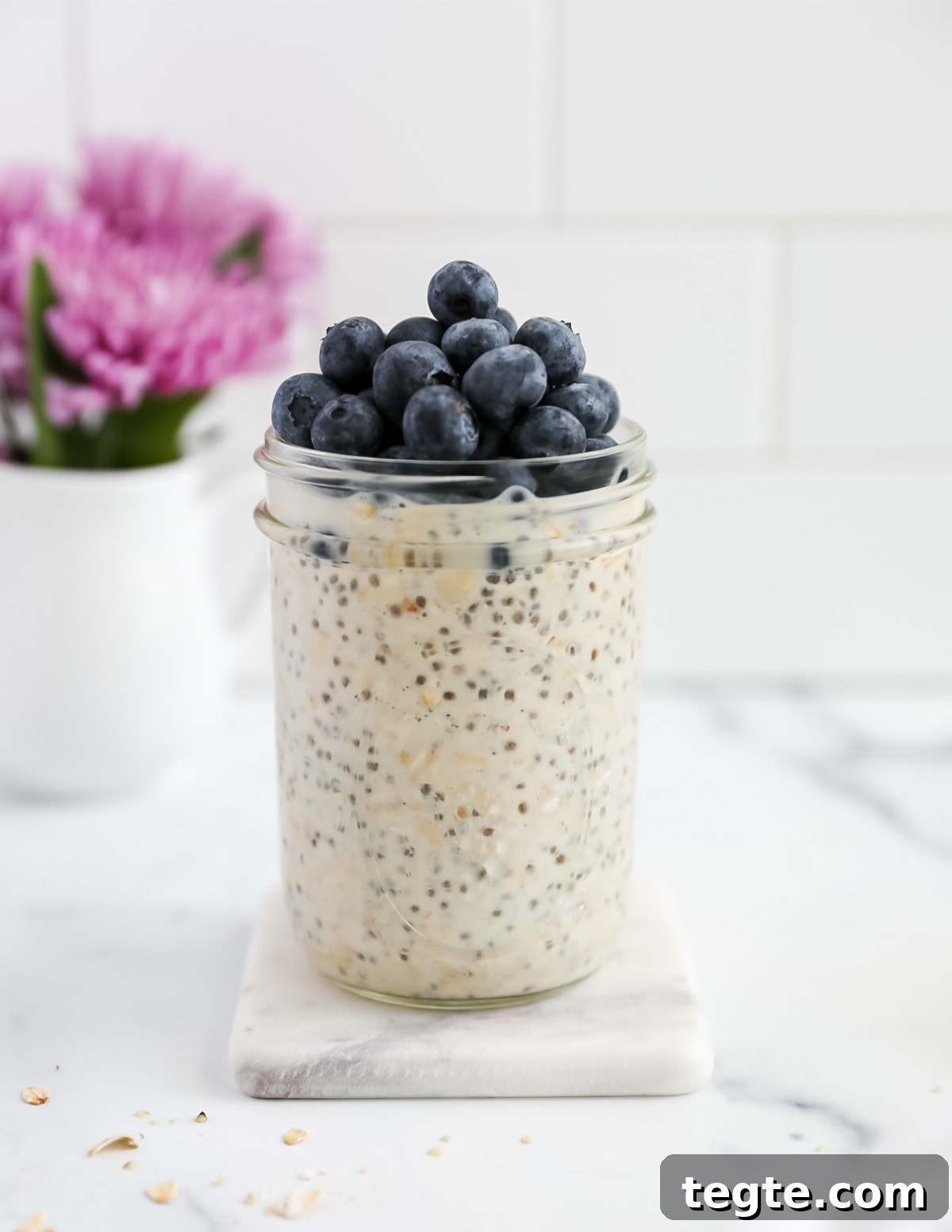 Creamy Chia Seed Overnight Oats Recipe for Quick Breakfast 6 A side shot of oats in a jar with blueberries on top