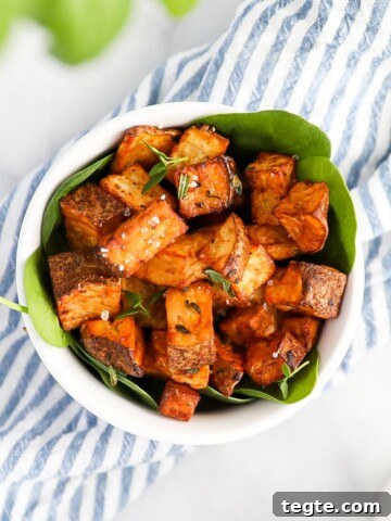 Crispy diced potatoes garnished with herbs