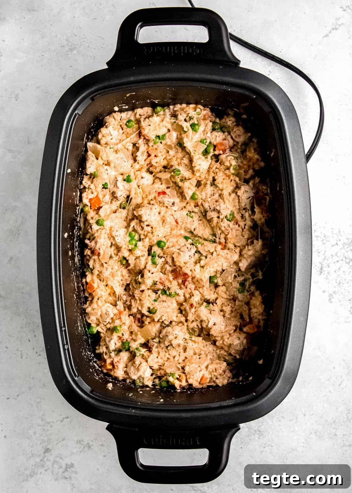 cheesy, creamy chicken and rice in a large crock pot