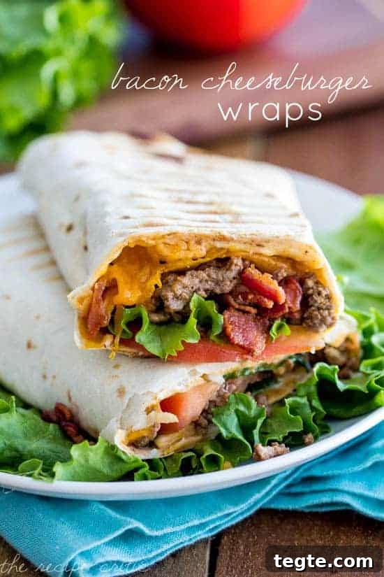 Delicious bacon cheeseburgers in a wrap. This is a meal the family is sure to love! Bacon Cheeseburger Wraps on a white plate with a blue table towel under it.