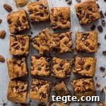 Vegan peanut butter chocolate chip pecan bars - incredibly moreish vegan peanut butter snack bars loaded with chocolate chips and pecans.